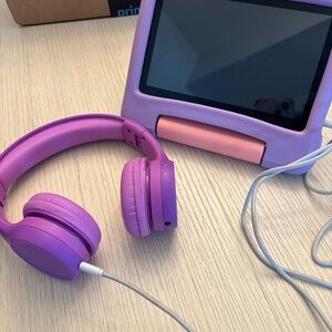 Purple Amazon Fire Kids 7, with sound limiting headphones